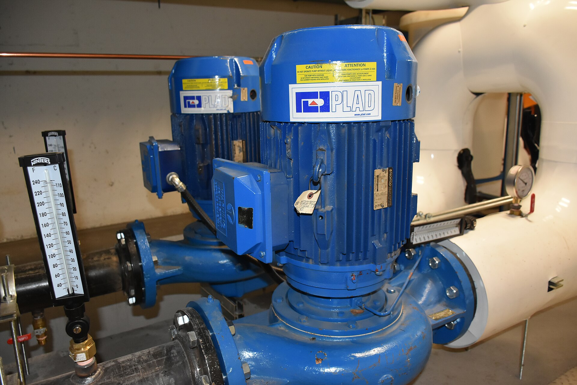 Industrial centrifugal pumps coupled to electric motors in a plant room